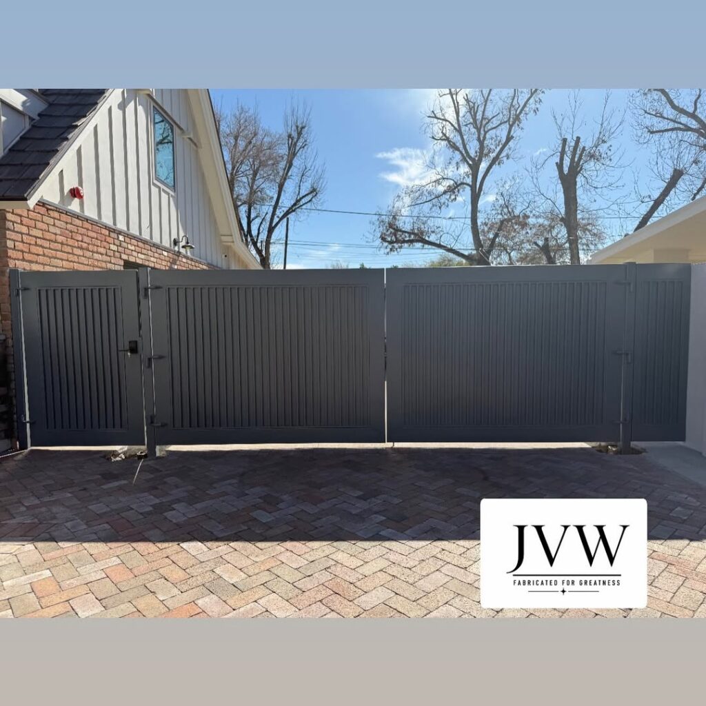 Black metal dual swing driveway gate