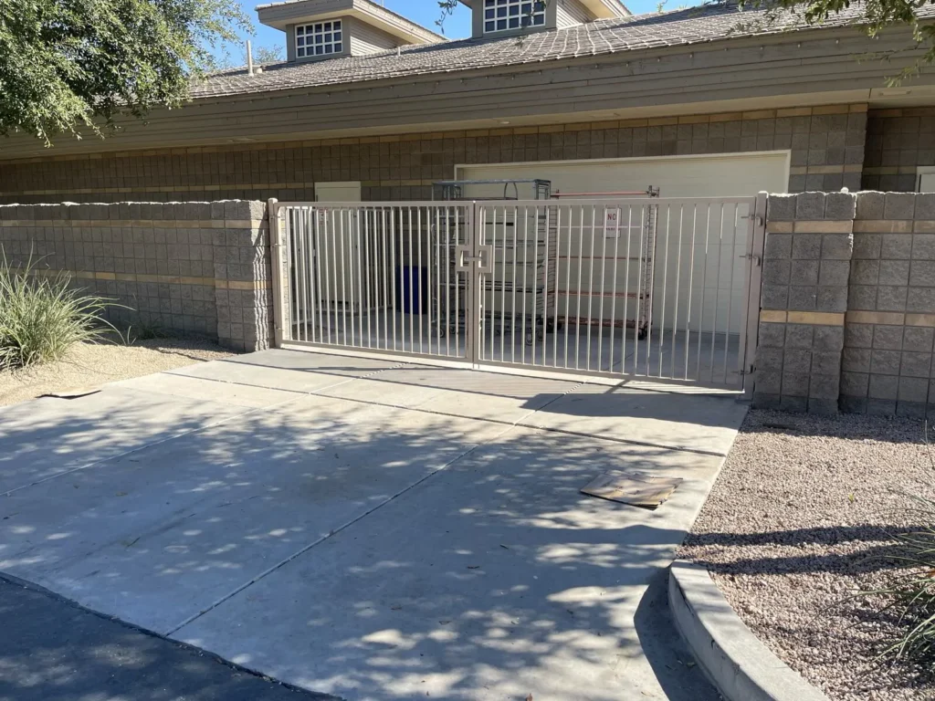 Black metal gate at community driveway entrance