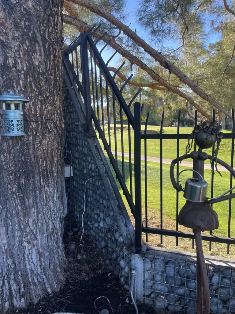 Decorative black wrought iron fence detail