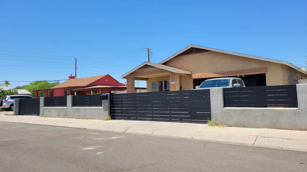Black metal fence and gate at a home exterior