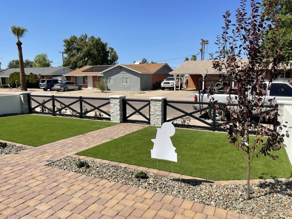 Custom metal privacy fence surrounding a yard